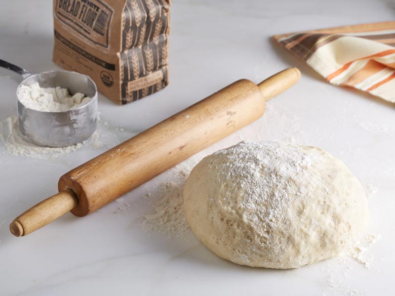 add more flour in the pizza dough
