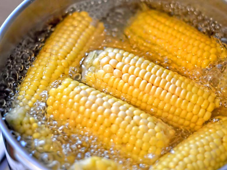 boiling the corn for soup