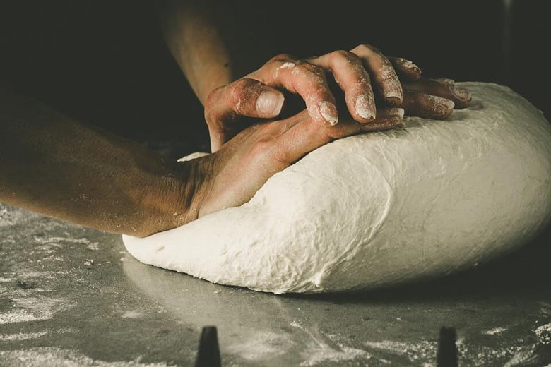 knead the pizza dough more